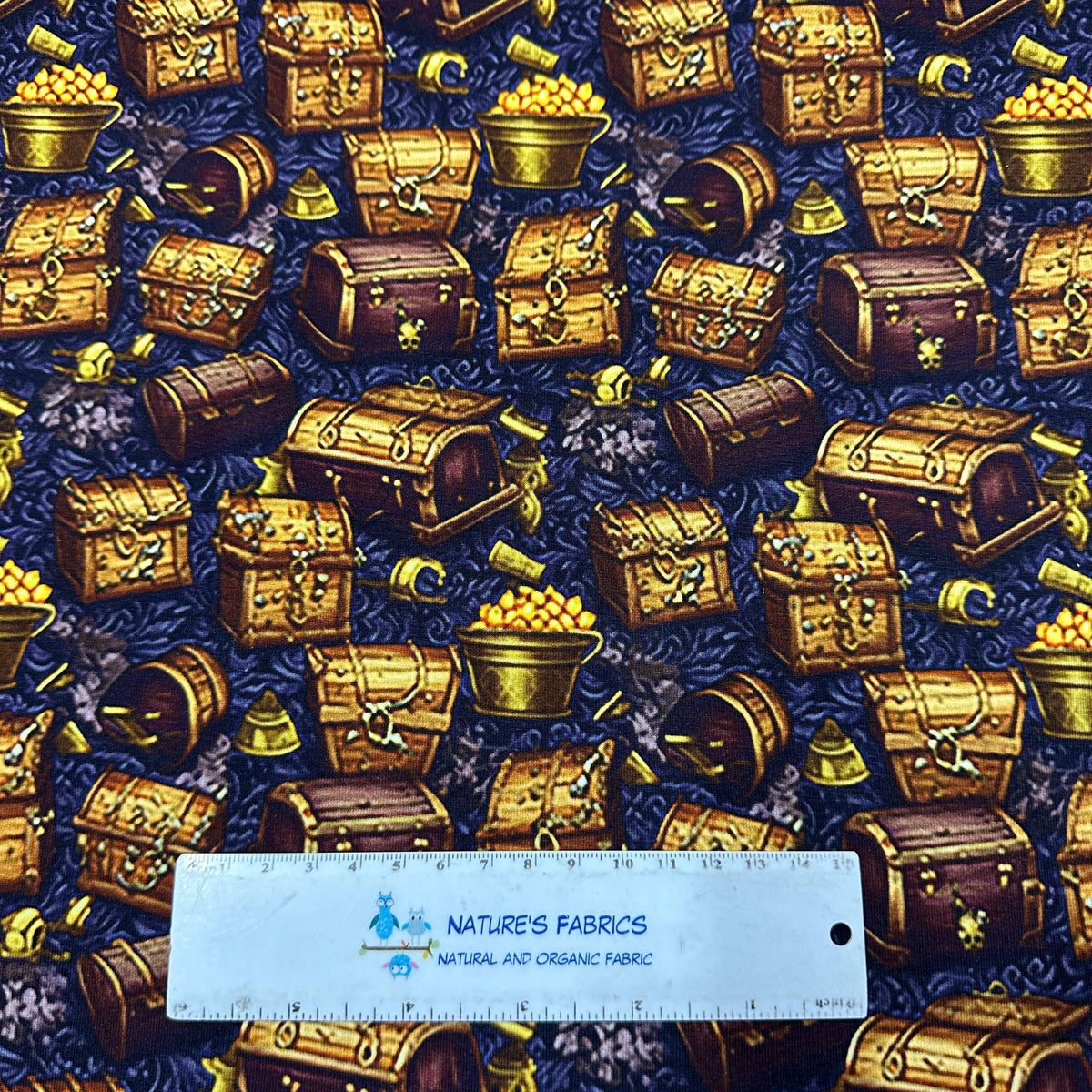 Nature's Fabrics pirate treasure chest and gold coin patterned fabric with measuring ruler.