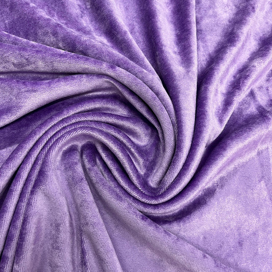 Swirl of luxurious purple velvet fabric from Nature's Fabrics
