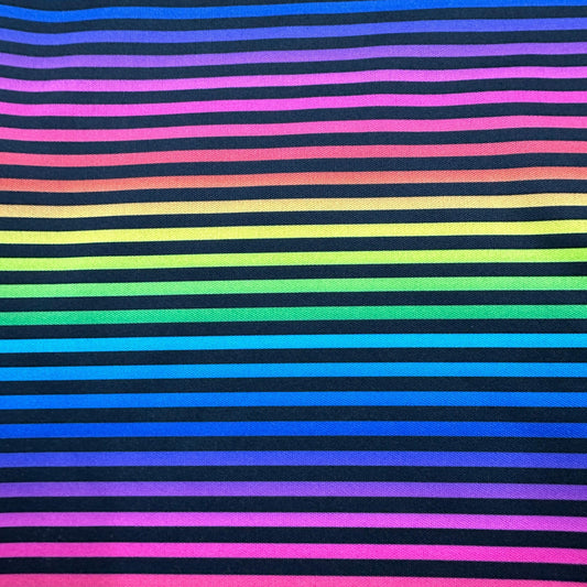 Rainbow striped fabric by Nature's Fabrics with colorful horizontal lines on black background.
