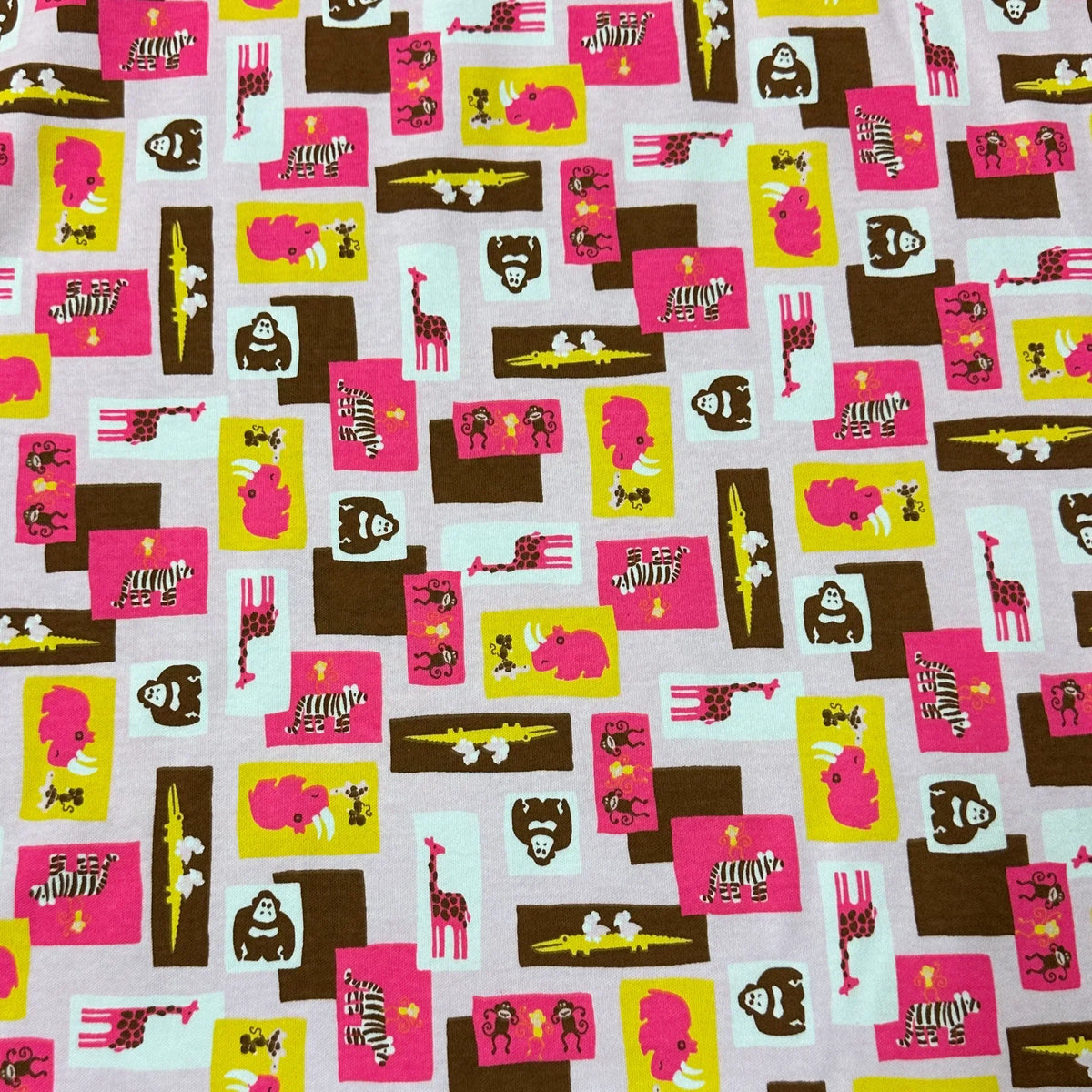 Nature's Fabrics pink organic cotton fabric with colorful animal prints