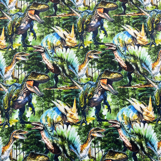 Nature's Fabrics dinosaur print fabric featuring T-Rex, Triceratops, and Spinosaurus.