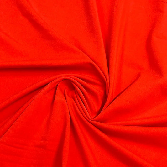 Red natural fabric from Nature's Fabrics draped in a spiral swirl.