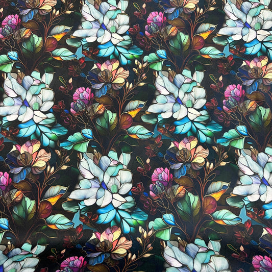 Nature's Fabrics premium fabric with blue and pink floral patterns on a dark background