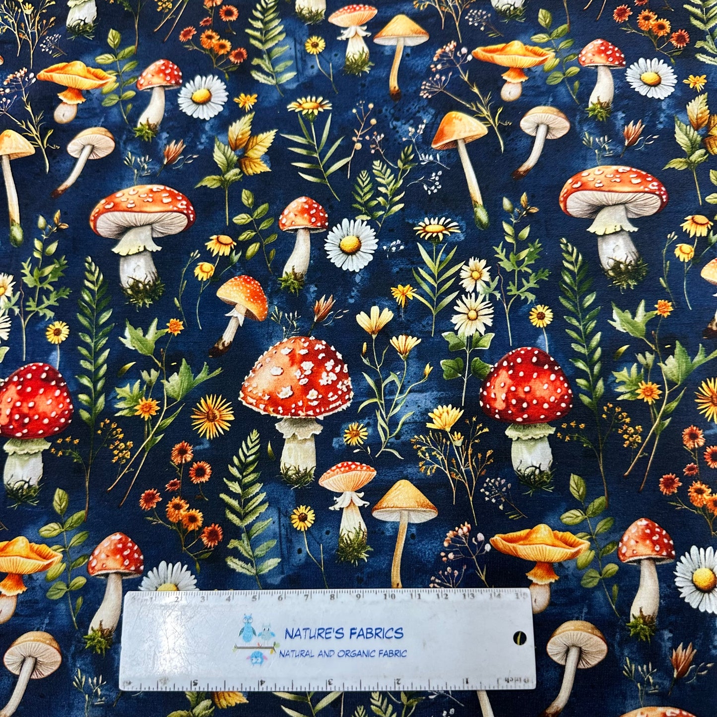 Toadstools on Blue Bamboo/Spandex Jersey Fabric - Nature's Fabrics