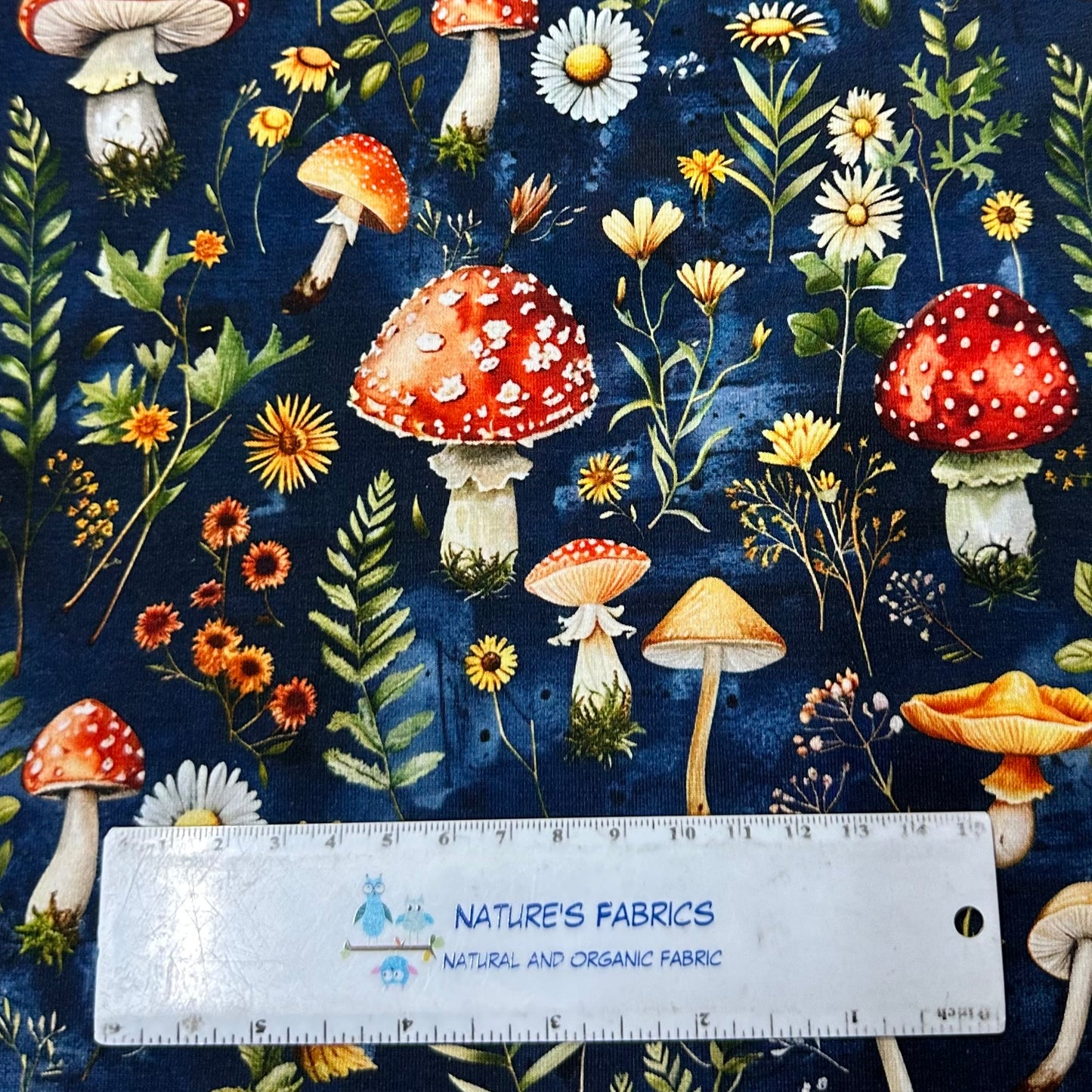 Toadstools on Blue Bamboo/Spandex Jersey Fabric - Nature's Fabrics
