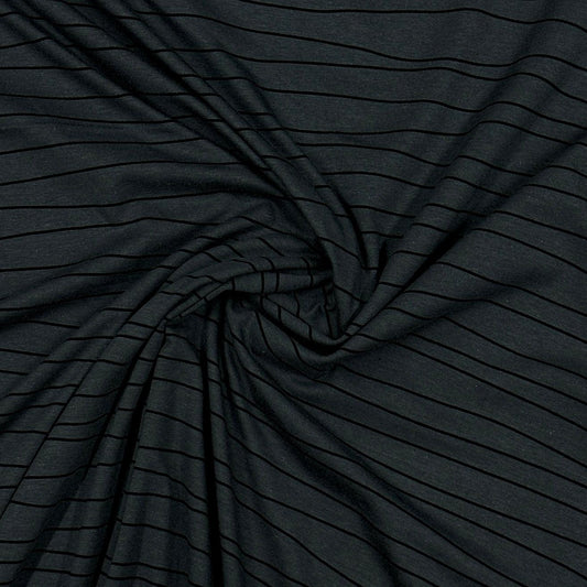 Nature's Fabrics black striped organic cotton fabric draped in a swirl
