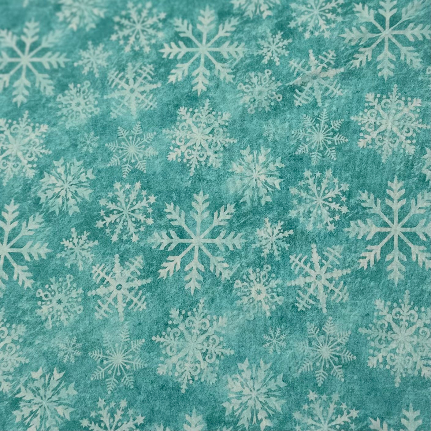 White Snowflakes on Aqua Organic Cotton/Spandex Jersey Fabric - Nature's Fabrics