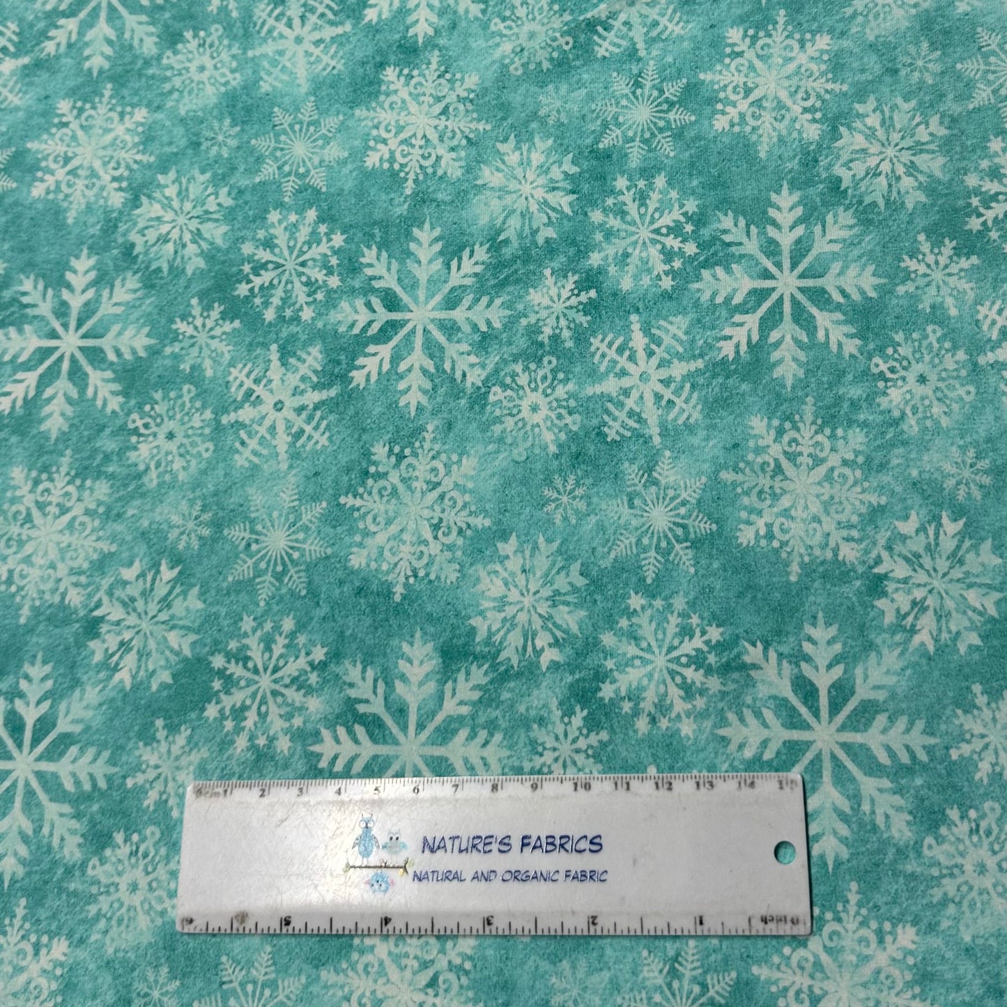 White Snowflakes on Aqua Organic Cotton/Spandex Jersey Fabric - Nature's Fabrics
