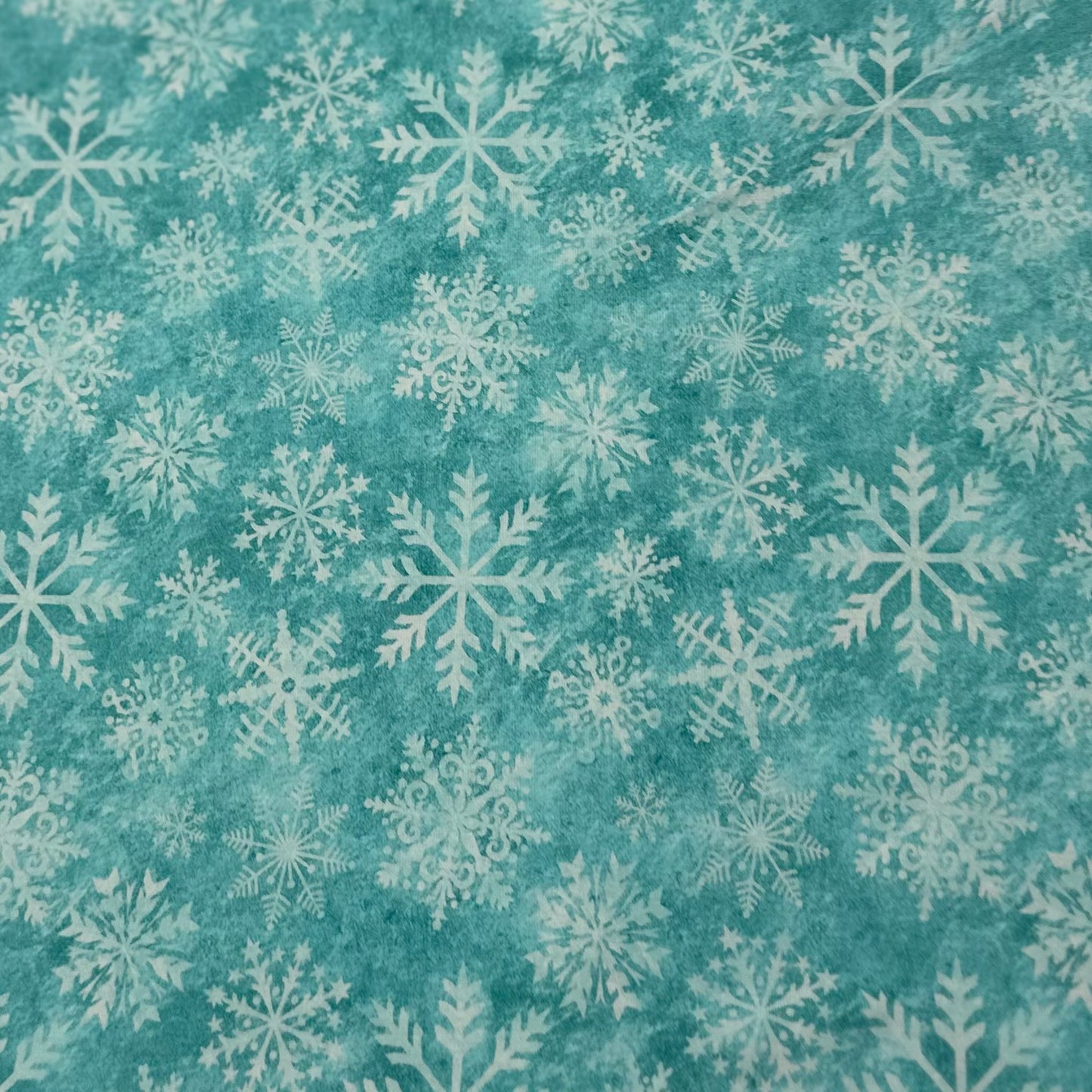 White Snowflakes on Aqua Organic Cotton/Spandex Jersey Fabric - Nature's Fabrics