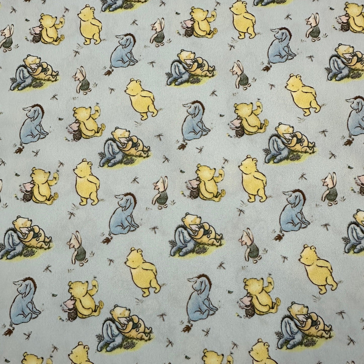 Winnie the Pooh and Friends on Blue 1 mil PUL Fabric - Made in the USA - Nature's Fabrics