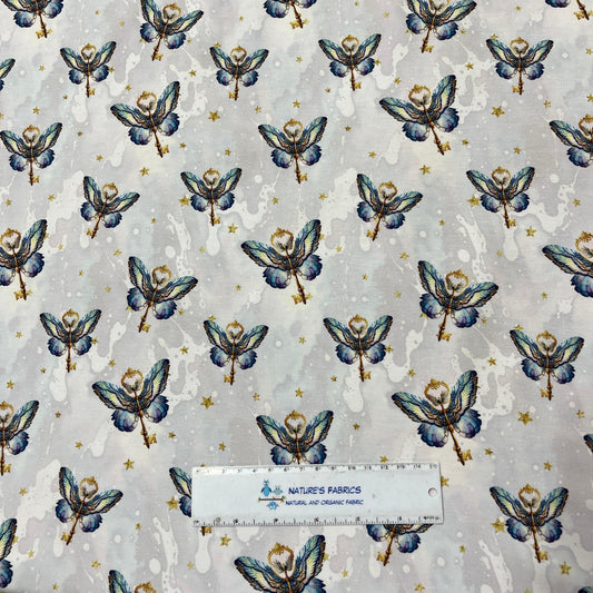 Nature's Fabrics light grey organic fabric with blue butterfly and gold star pattern