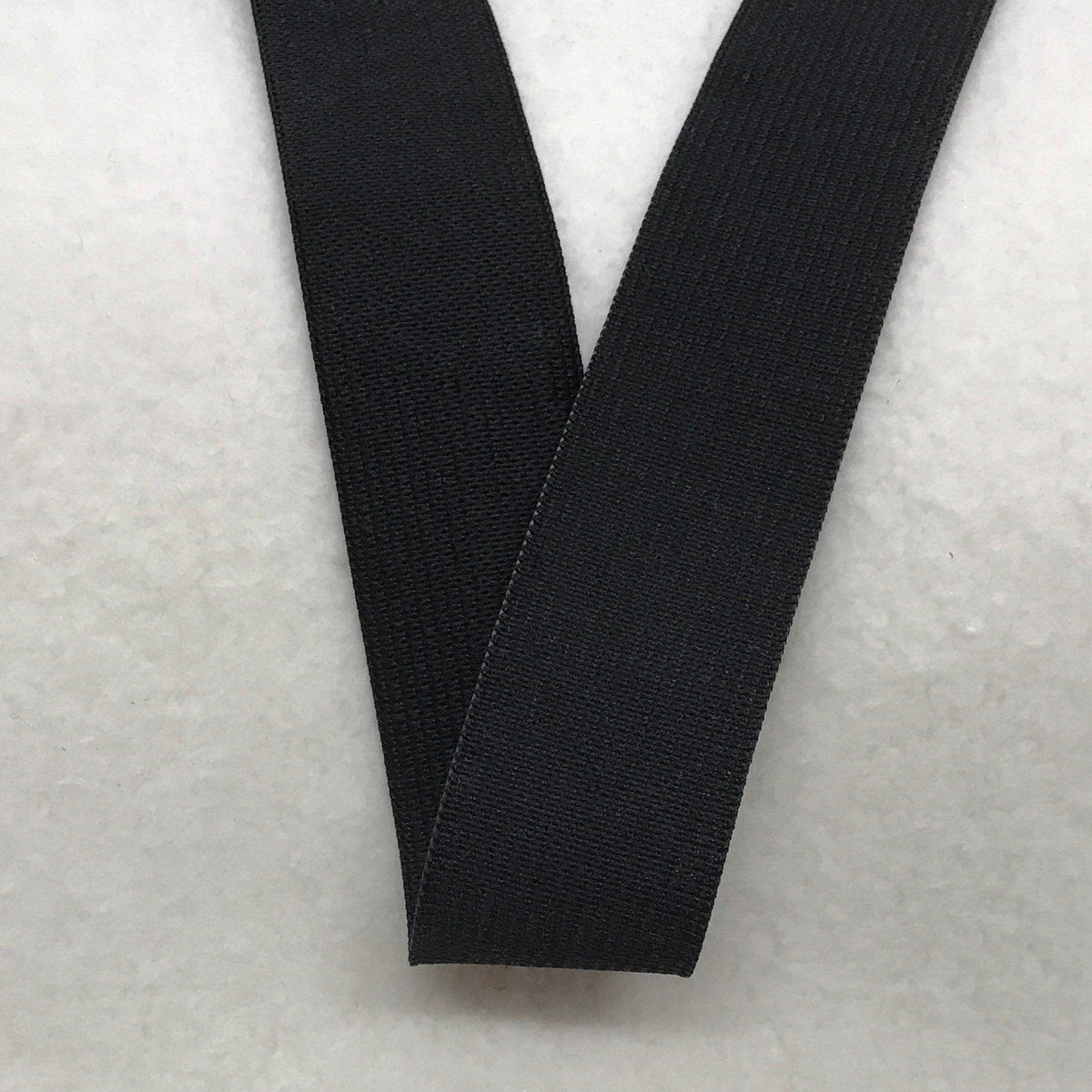 Black Nature's Fabrics ribbed webbing tape on a white background