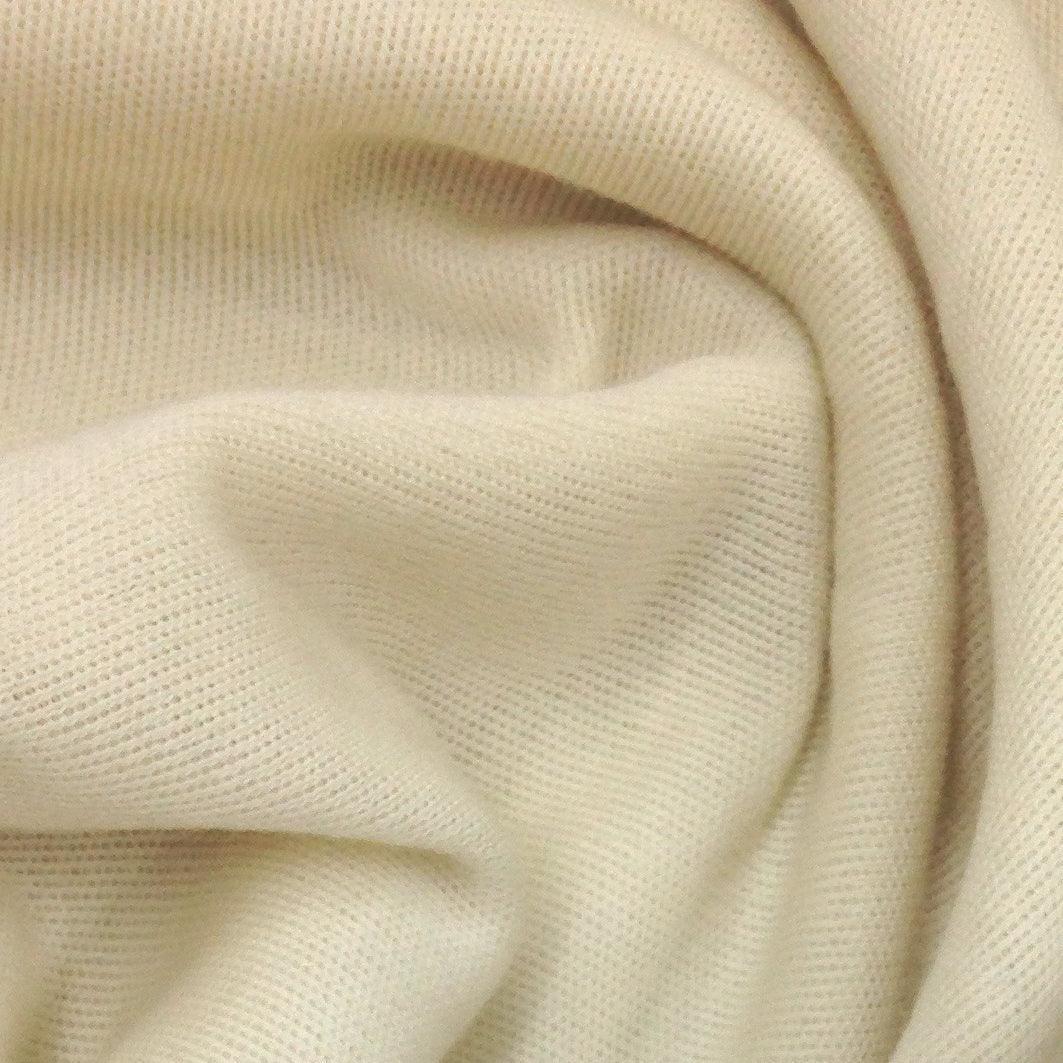 Close-up of cream-colored organic fabric folds from Nature's Fabrics.