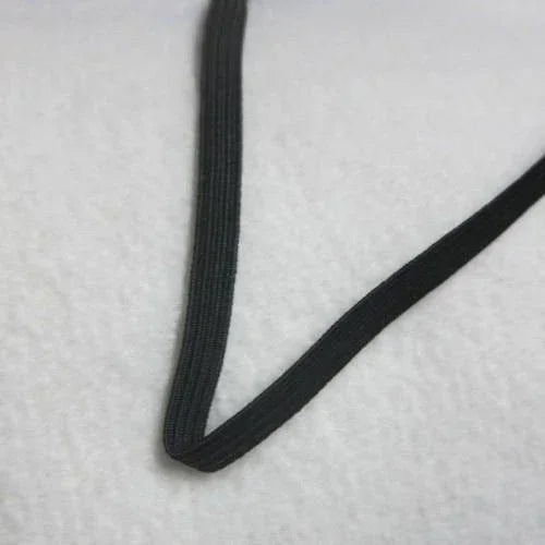 Black elastic band from Nature's Fabrics on a white textured background