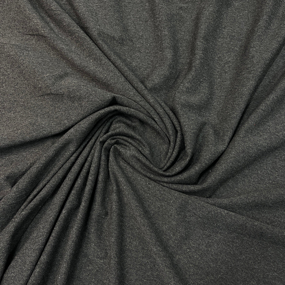 Charcoal grey premium natural fabric swirled in a spiral by Nature's Fabrics.