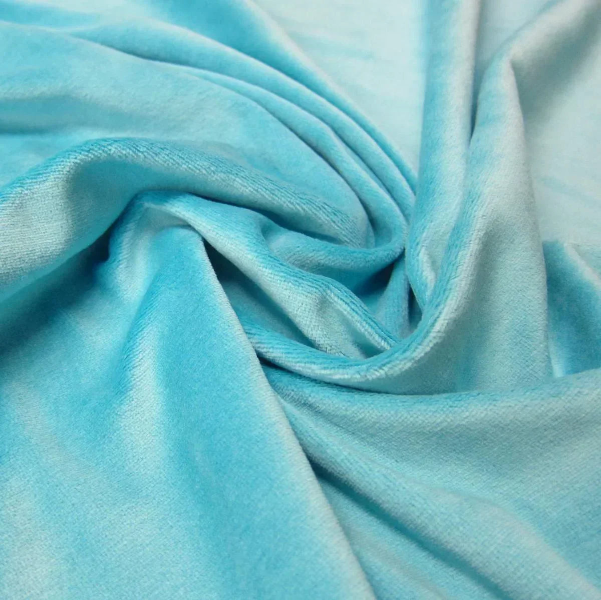Light blue velvet fabric draped in folds from Nature's Fabrics