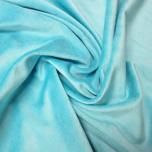 Light blue velvet fabric draped in folds from Nature's Fabrics