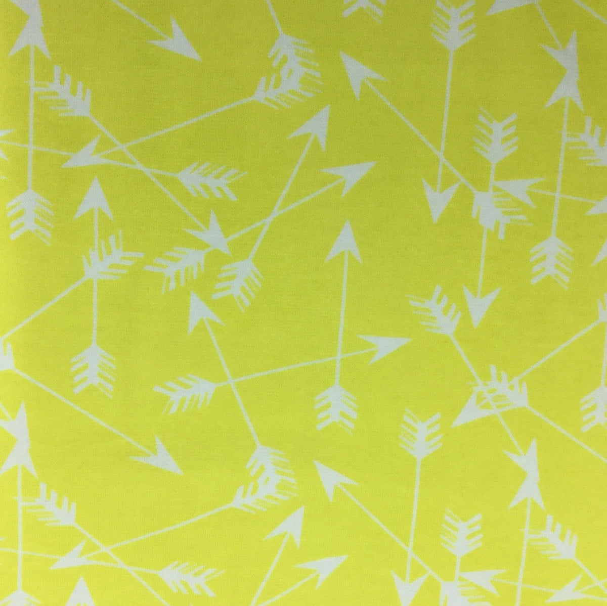 Yellow Nature's Fabrics fabric with a white arrow pattern.