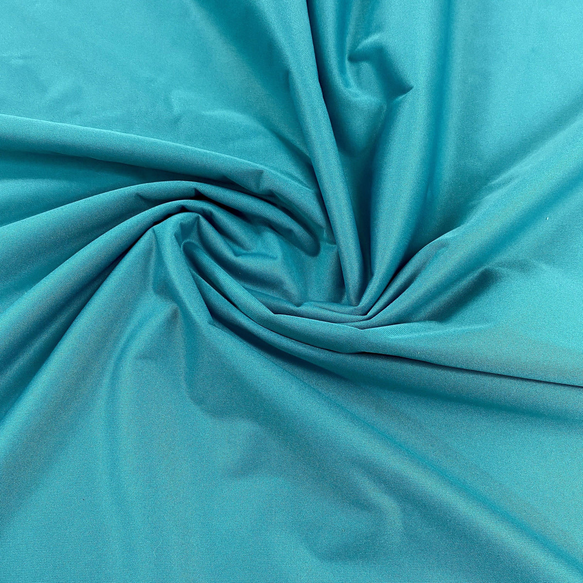 Draped teal blue natural fabric from Nature's Fabrics.