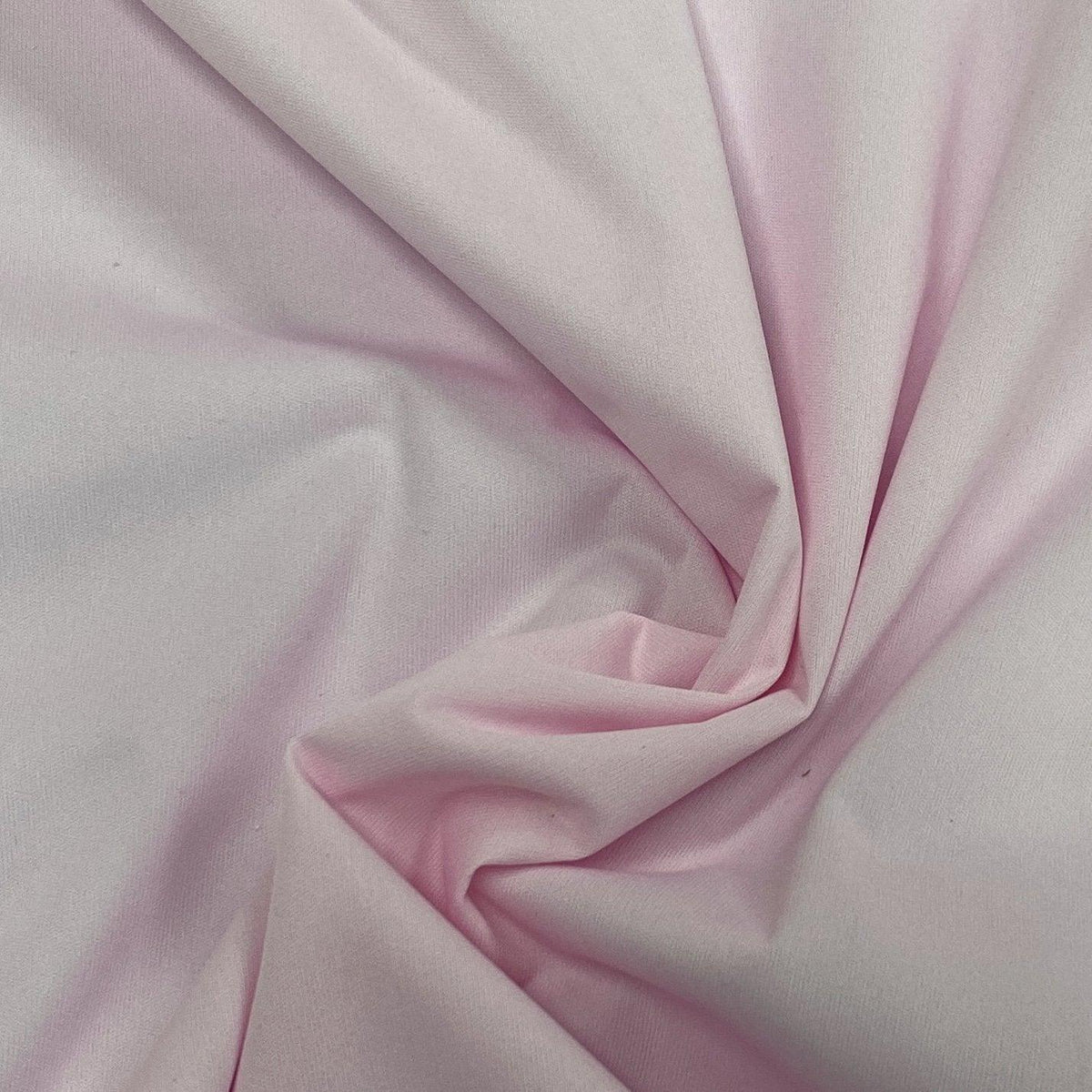 Draped light pink organic cotton fabric from Nature's Fabrics
