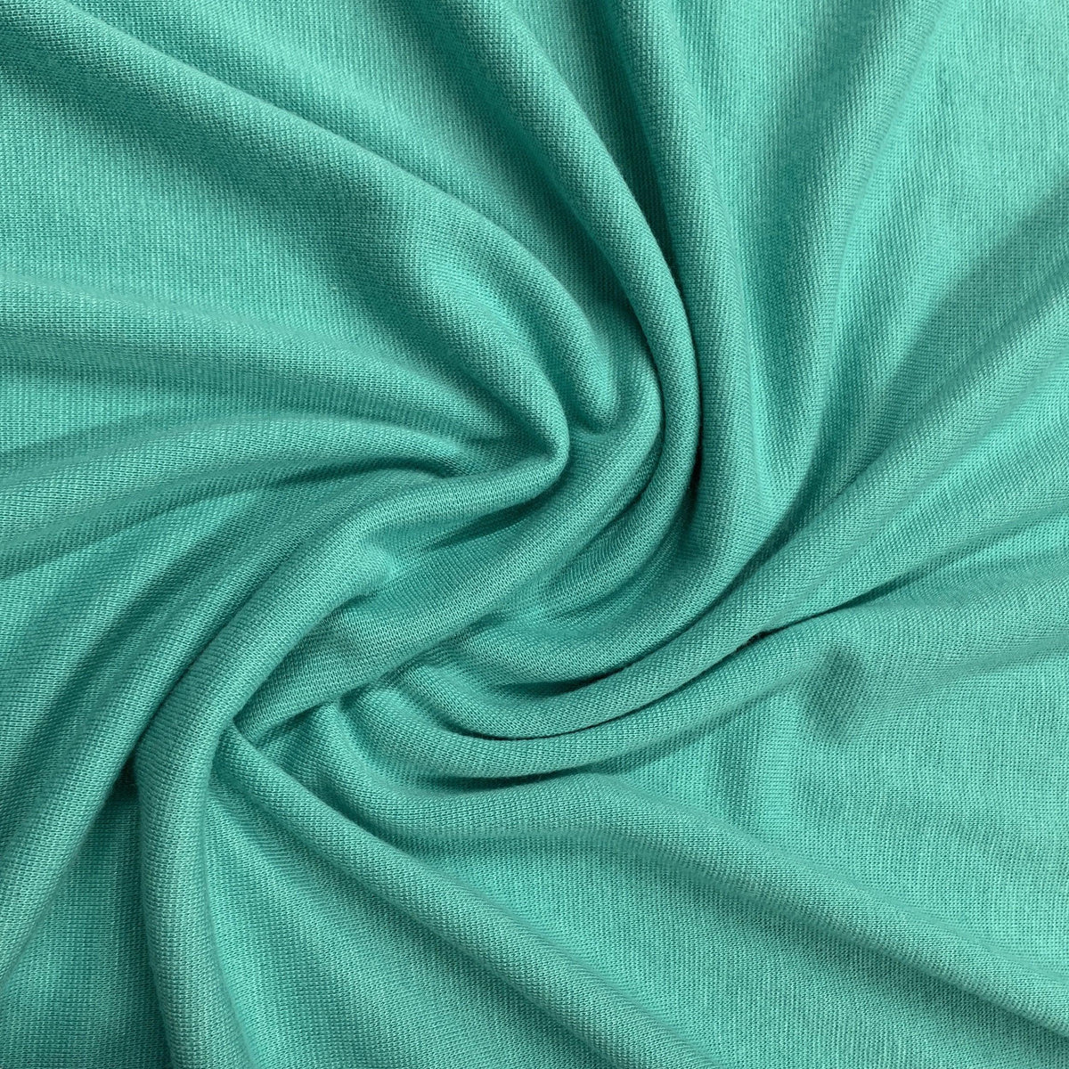 Swirled teal-green natural fabric from Nature's Fabrics