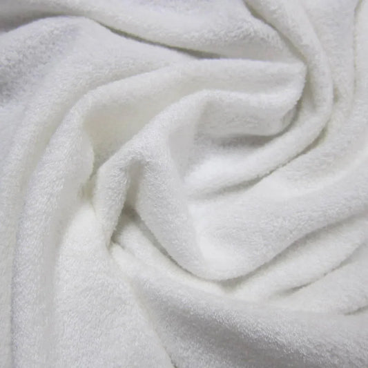 Close-up of soft, white textured fabric from Nature's Fabrics.