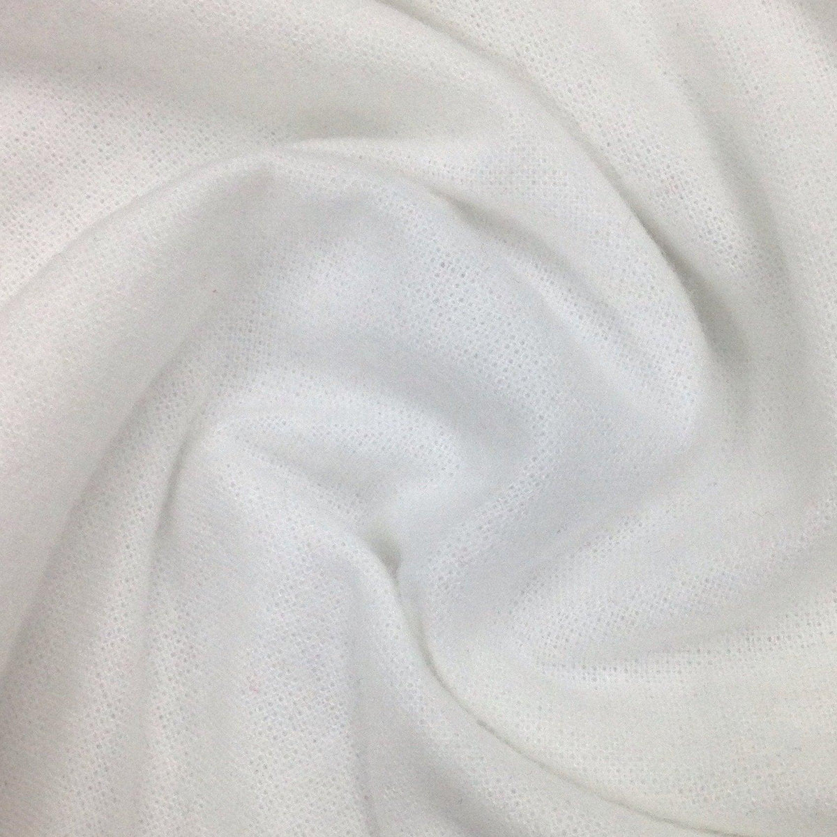 Close-up of draped white natural fabric by Nature's Fabrics
