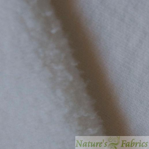 Close-up of soft, white natural fabric texture from Nature's Fabrics