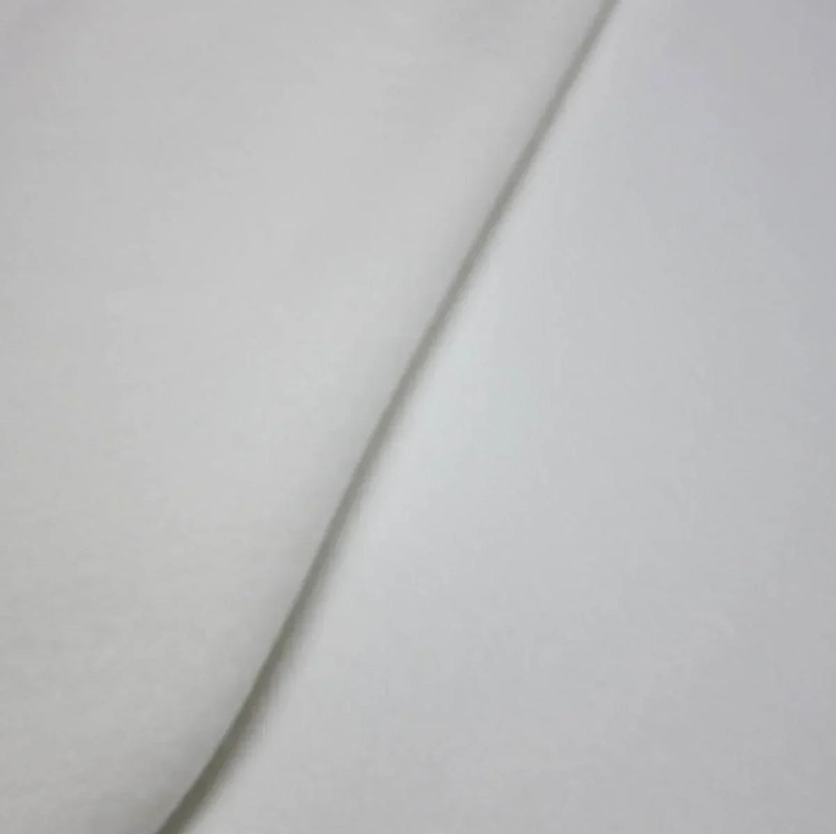 Close-up of a soft white fabric fold from Nature's Fabrics.