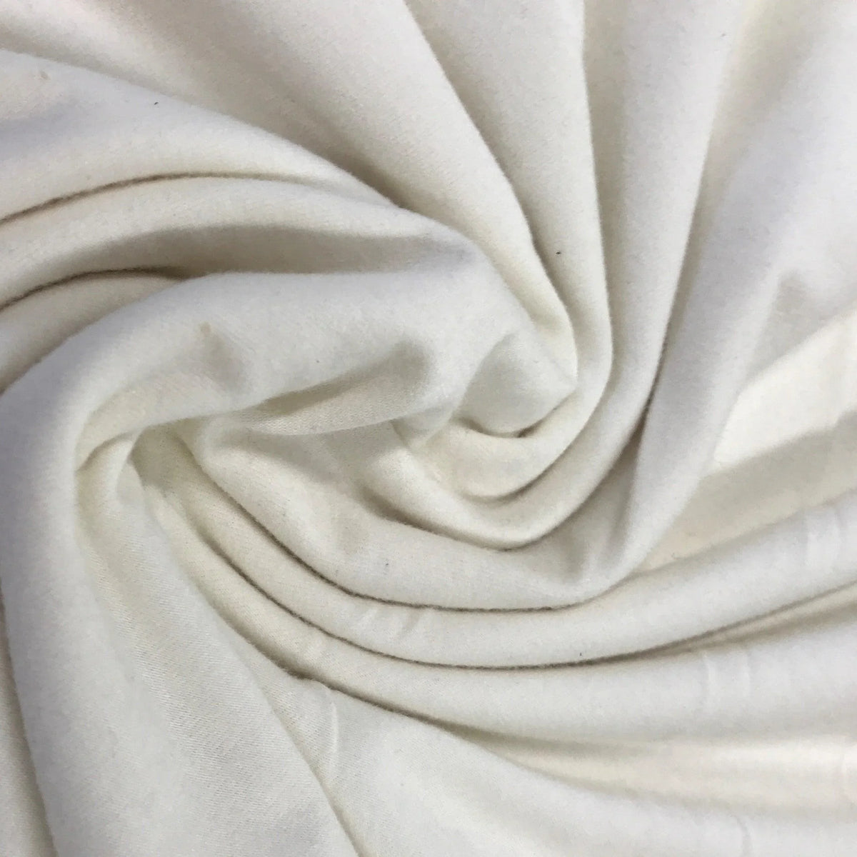 Swirl of premium white organic cotton fabric from Nature's Fabrics