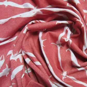 Nature's Fabrics red and white patterned natural fabric draped in soft folds