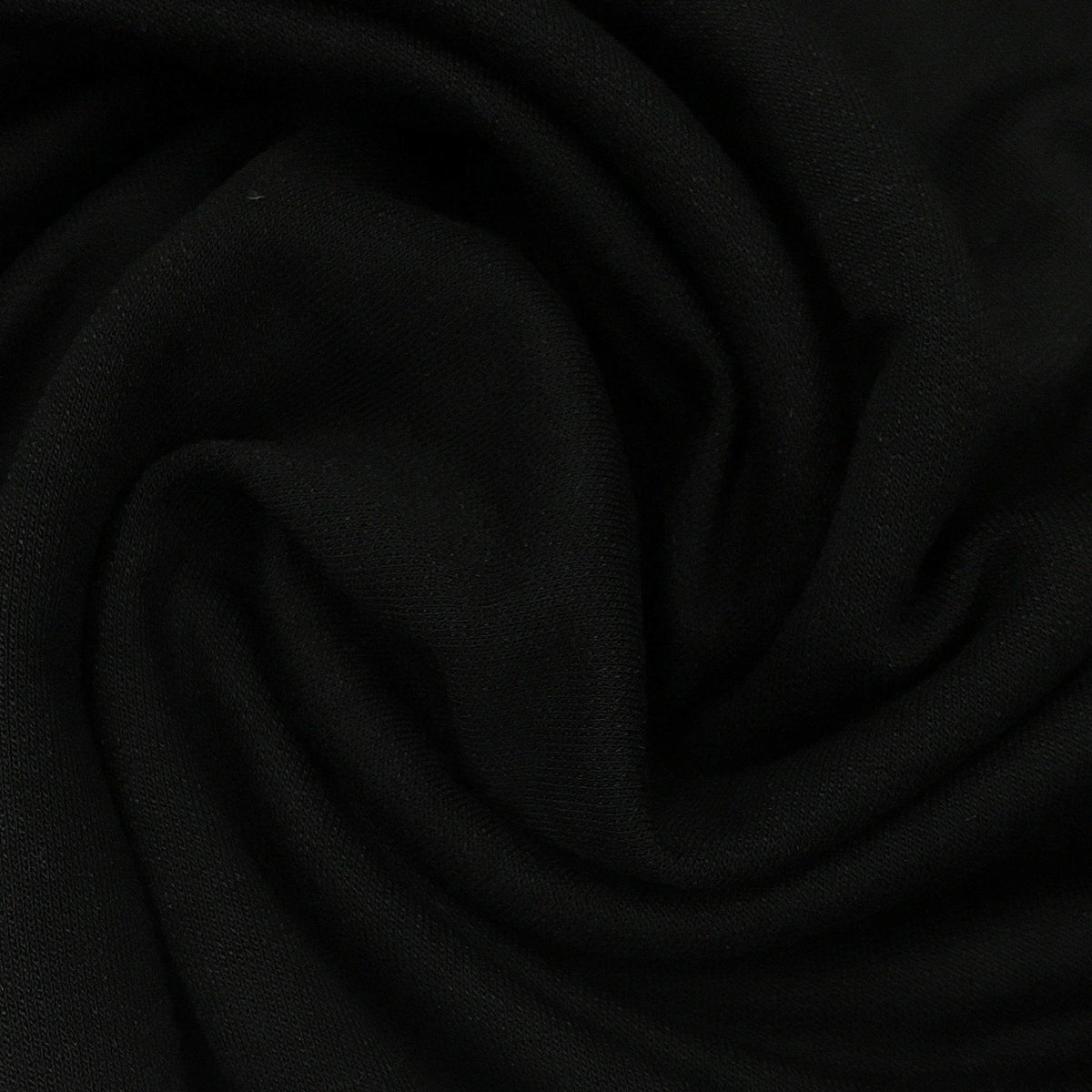 Close-up of draped black premium natural fabric from Nature's Fabrics