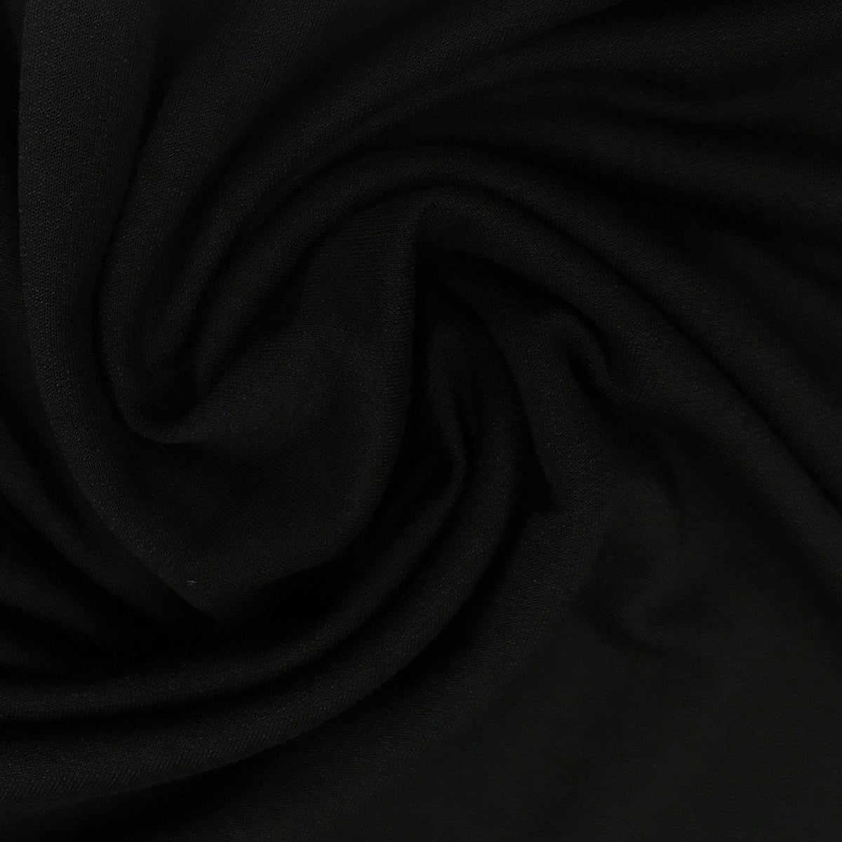 Close-up of draped black natural fabric from Nature's Fabrics