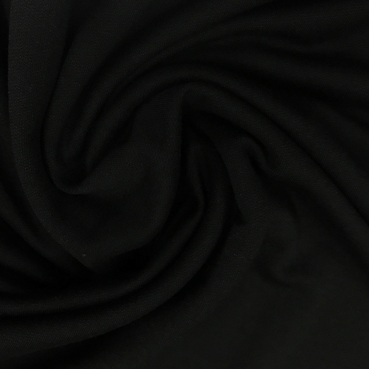 Close-up of draped black premium natural fabric from Nature's Fabrics