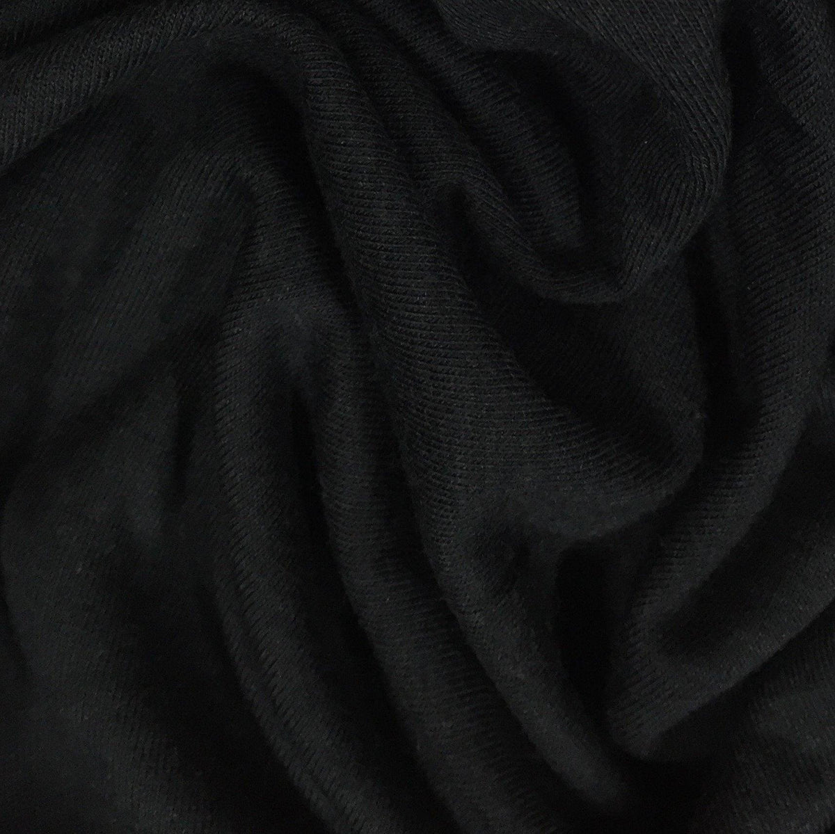 Close-up of draped black natural fabric from Nature's Fabrics