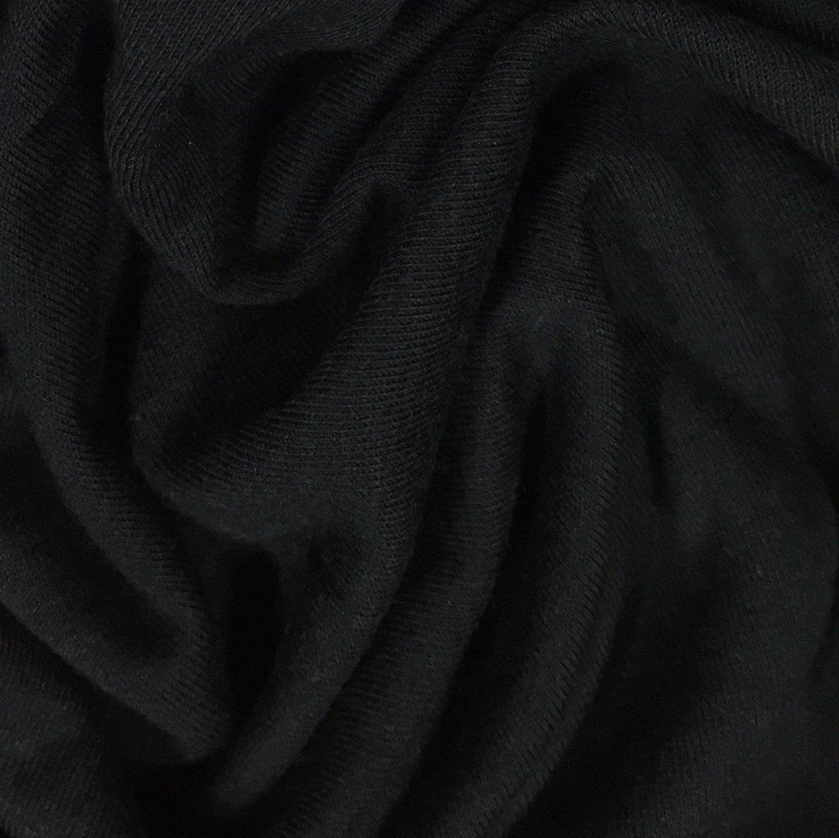 Close-up of draped black organic cotton fabric from Nature's Fabrics