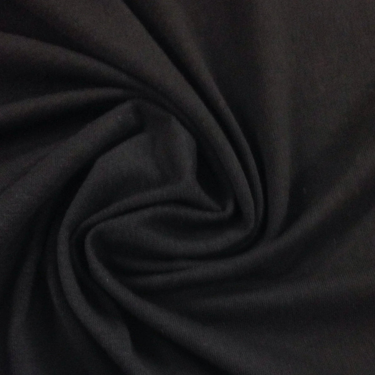 Close-up of draped black natural fabric from Nature's Fabrics