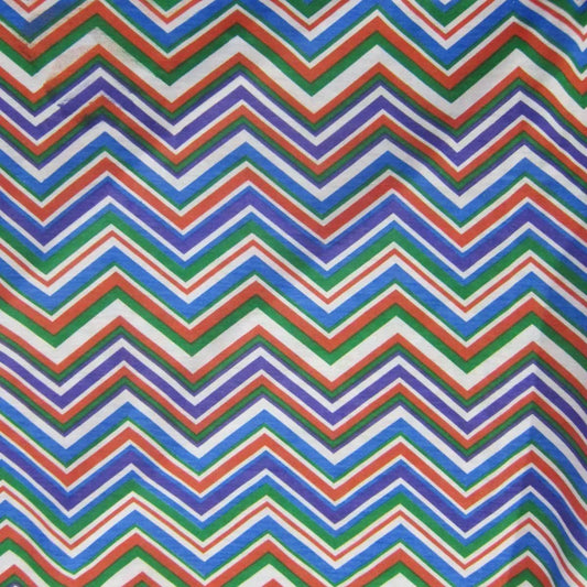 Nature's Fabrics colorful zig-zag chevron patterned textile in blue, red, green and purple