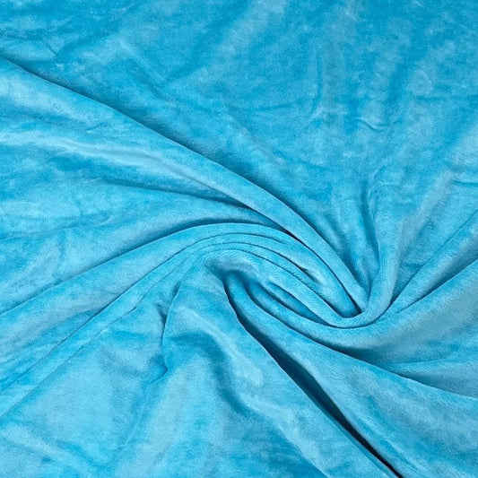 Turquoise blue textured fabric draped in folds from Nature's Fabrics