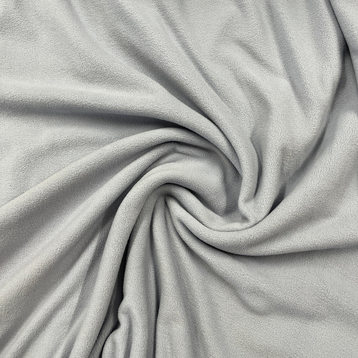 Close-up of draped grey soft fleece fabric from Nature's Fabrics.