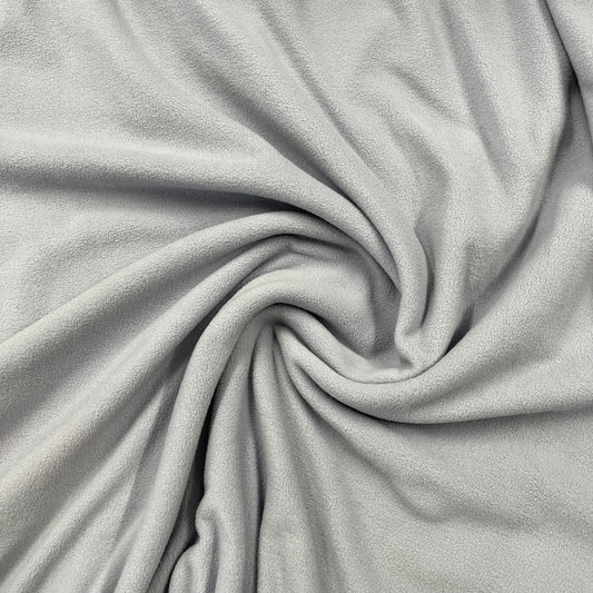 Close-up of draped grey soft fleece fabric from Nature's Fabrics.