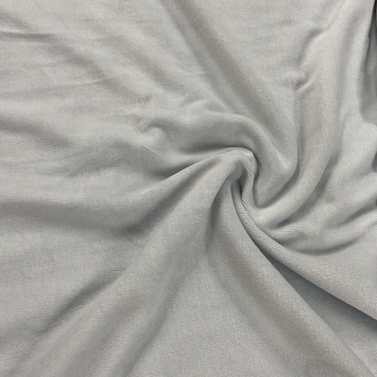 Close-up of draped light grey premium natural fabric from Nature's Fabrics.