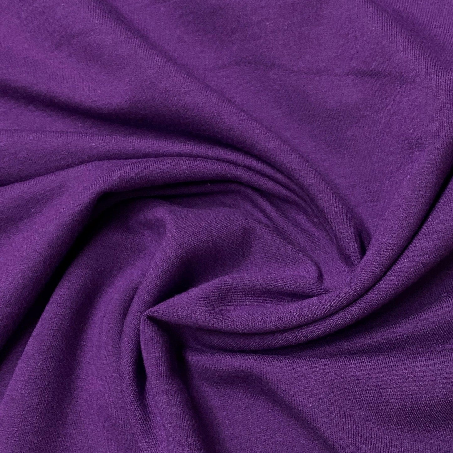 Close-up of draped purple natural fabric from Nature's Fabrics.
