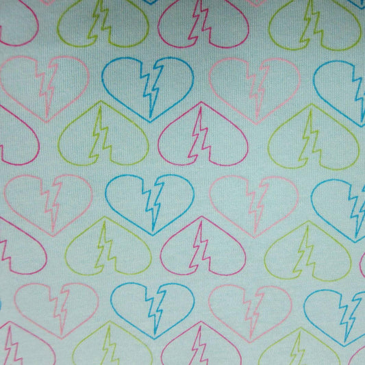 Broken Hearts on Blue Cotton Jersey Fabric - Nature's Fabrics