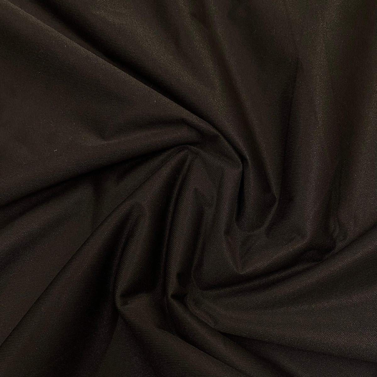 Close-up of draped black premium natural fabric from Nature's Fabrics