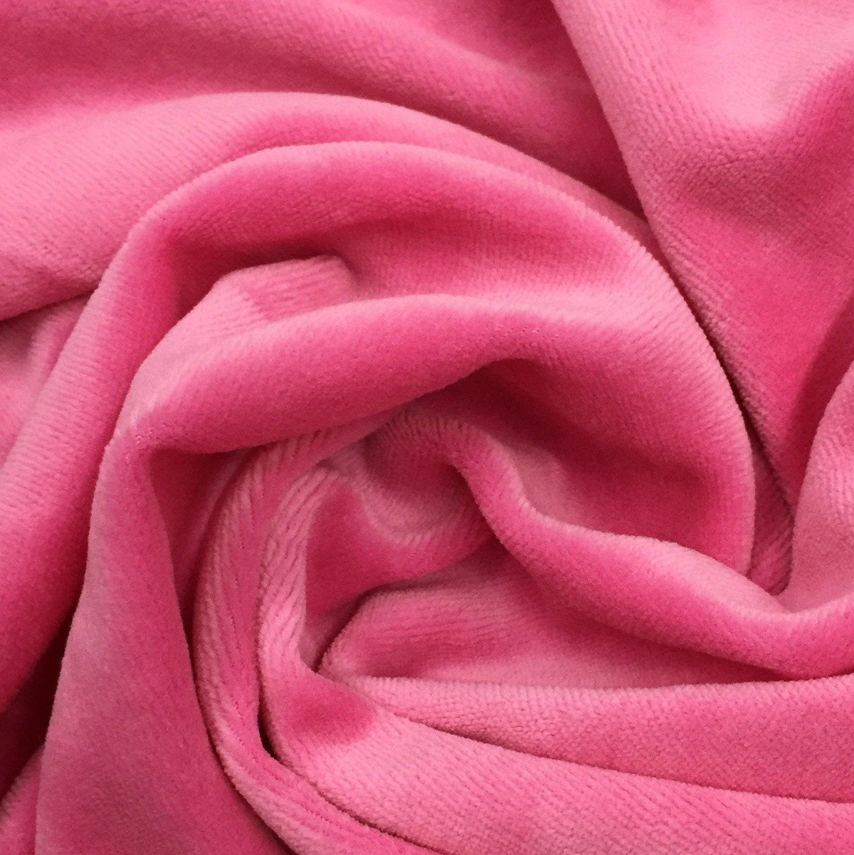 Close-up of draped pink velvet fabric from Nature's Fabrics.