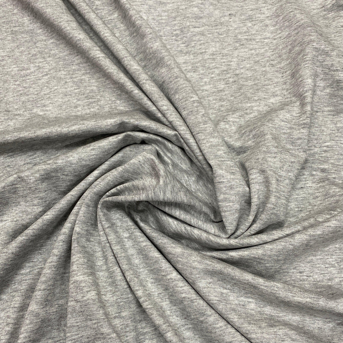 Close-up of swirled grey natural jersey fabric from Nature's Fabrics