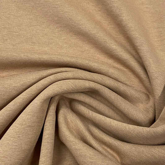 Nature's Fabrics beige organic cotton fabric with soft folds and texture