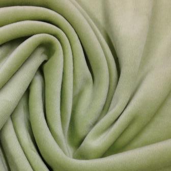 Close-up of draped sage green velvet fabric from Nature's Fabrics