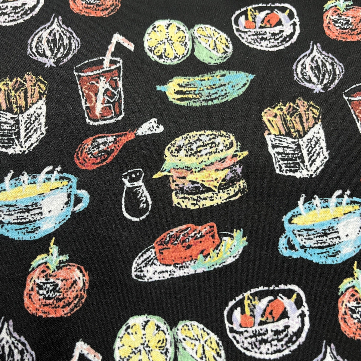 Nature's Fabrics black fabric with colorful food doodles including burgers and fries.